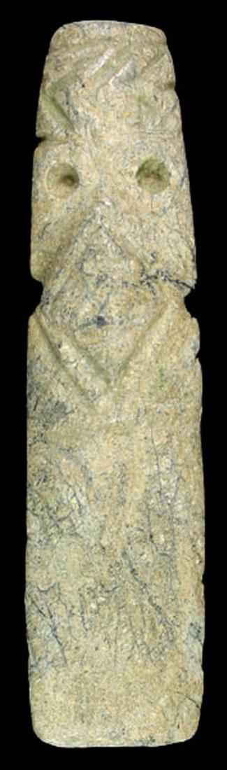 Pre-Columbian Avian-Shaman Form Axe God: Calcified Jade Axe God. Avian form that morphs into a Shaman form. Costa Rica. A.D. 1-500. Measures 3 3/8" x 7/8".