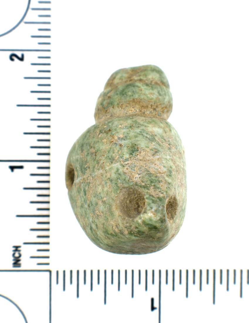 Large Mayan Seated Human Effigy Bead: Pre-Columbian Mayan Culture, ca. 600-900 A.D. Sits upright on base. Stylized human effigy bead uniquely biconically drilled three times around the perimeter for suspensiuon. Ex- Malter Galleries. Heav