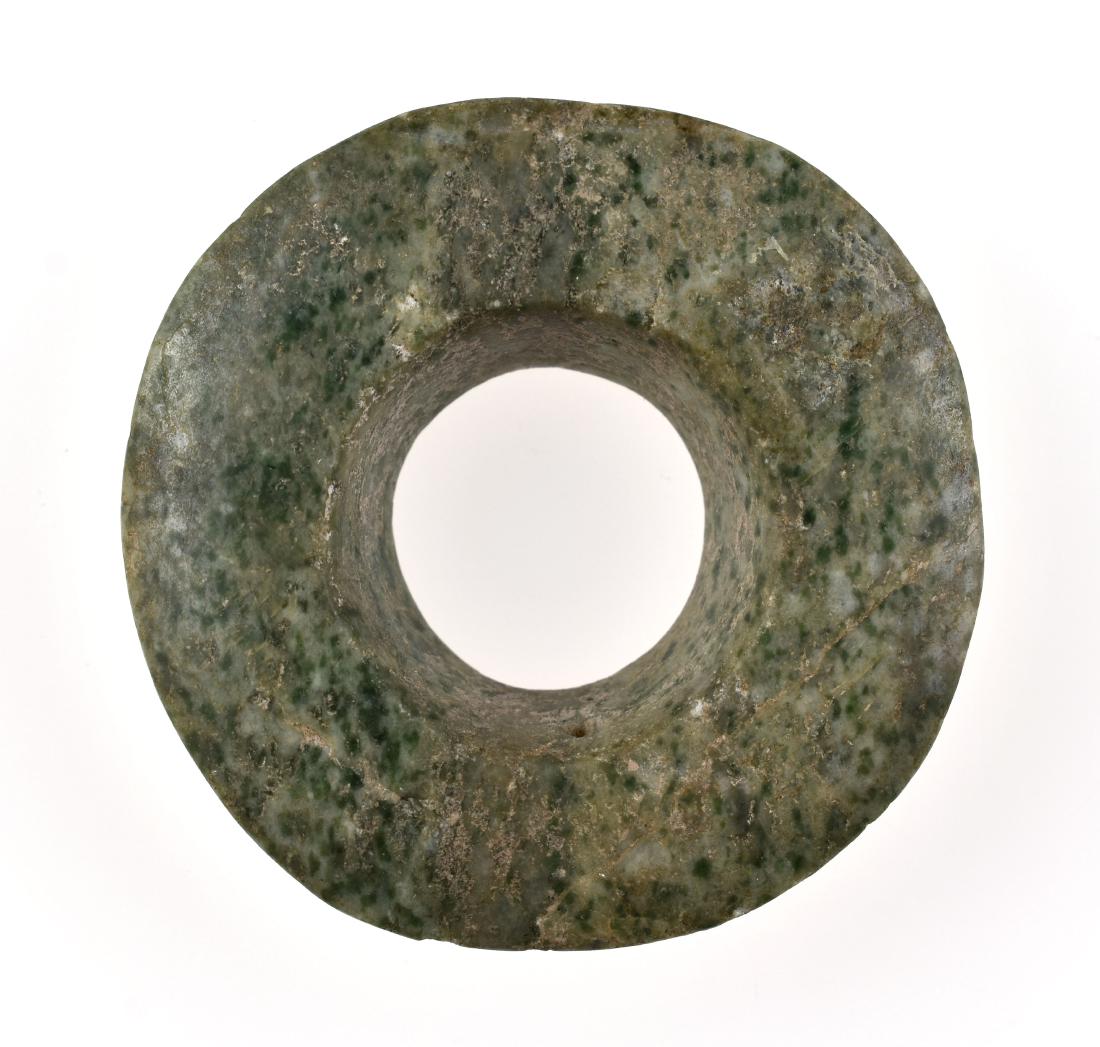 2 1/2" Mayan Jade Ear Flare: Pre-Columbian. Mayan Territories. ca. A.D. 250-900. Extra large and wide example. Ex- Jeff Sadofsky Collection. Finely polished Green Jade. Ear flares have been part of human expression and body modif