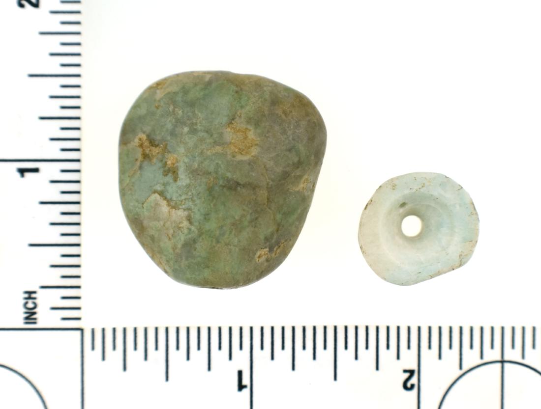 Fine Duo of Mayan Jade Beads: Pre-Columbian Mayan Culture, ca. 600-900 A.D. Both heavily polished. Larger 1 5/16" example is perfectly micro-drilled (amazing!!) biconically lengthwise. The smaller on is actually a central par