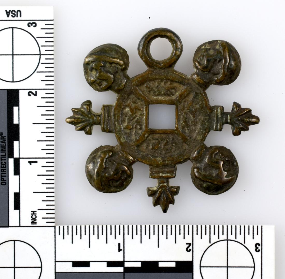 2-11/16" Medieval Escutcheon Plate: From Great Britain. Depicts four heads and lions in a circle. Probably mounted on a chest or a decorator for a home. Copper/Bronze.