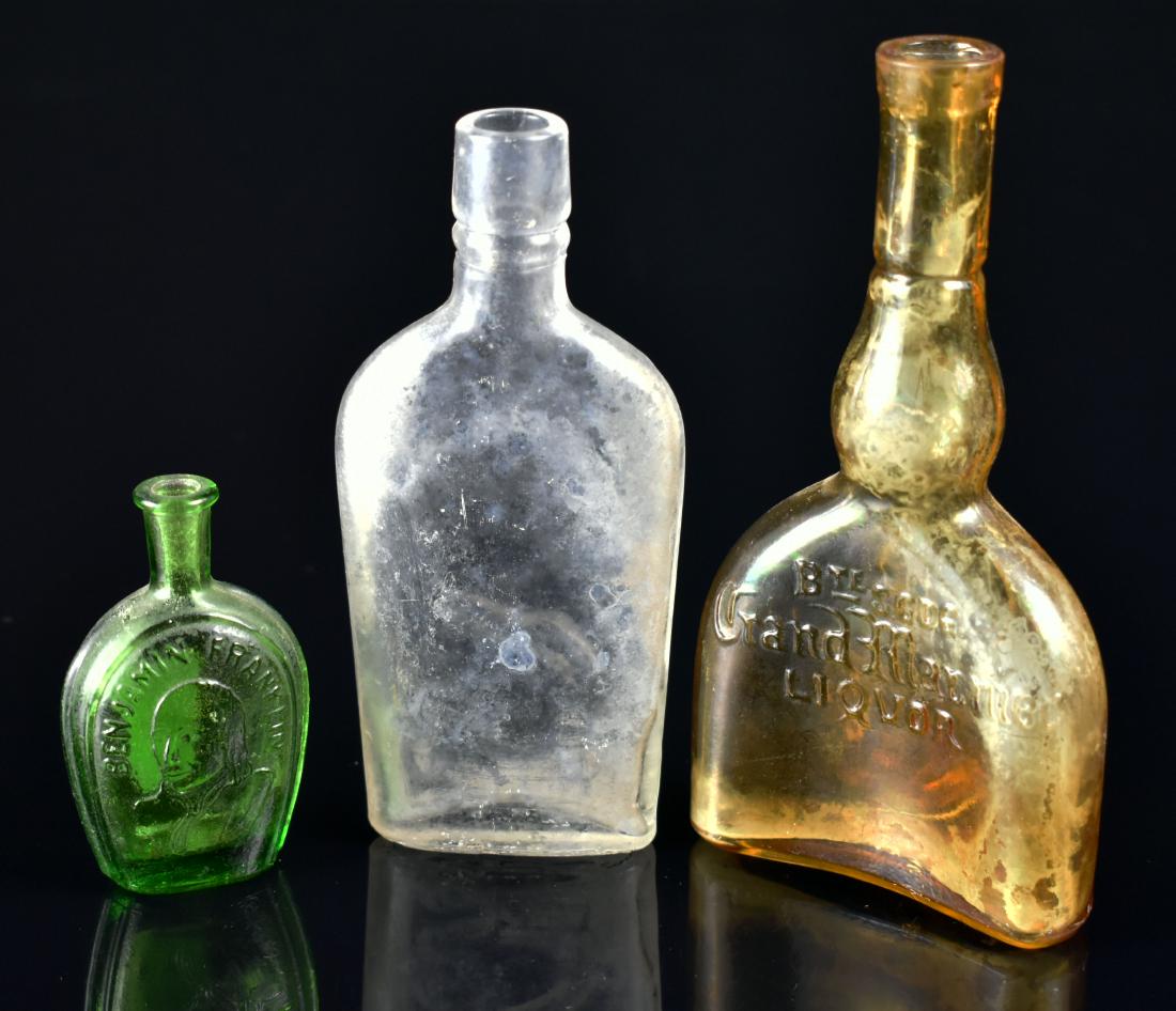 3 Vintage Liquor Bottles: Grand Marnier, Green Benjamin Franklin, and an unmarked whiskey flask.