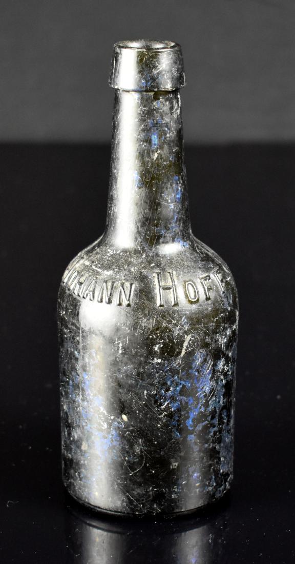 Johann Hoff Iridescent Bottle: Excellent old liquor bottle, green with a peacock blue iridescence in many large sections of the piece. Nice!