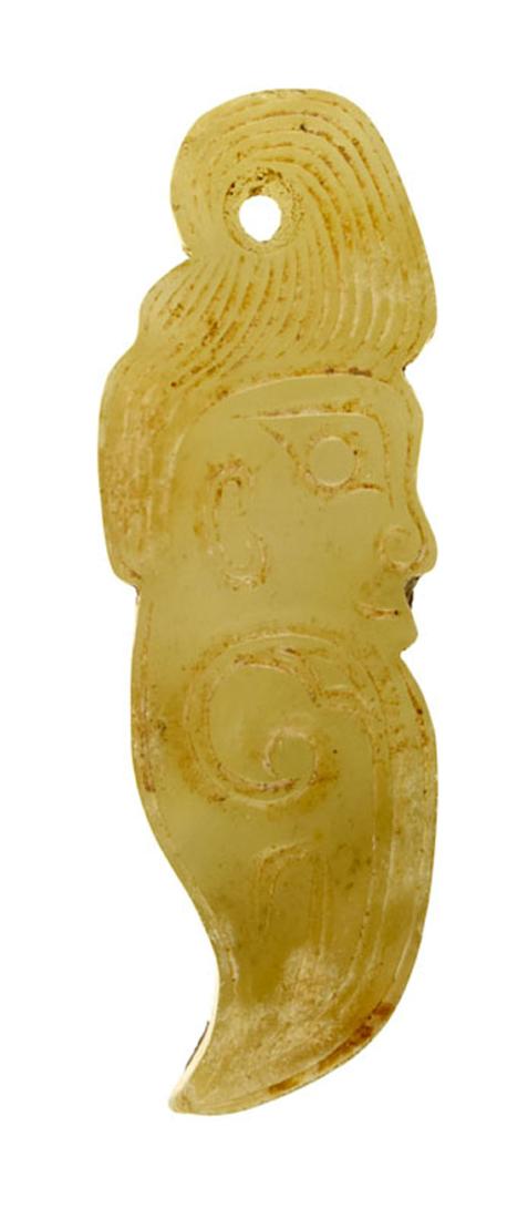CHINESE SHANG DYNASTY STYLE HUMAN EFFIGY PENDANT: Shang Dynasty Style Crouching Human Pendant. Depicts a crested crouching human figure similar to examples found in the tomb of Fu Hao at Yinxu, the ruins of the ancient Shang Dynasty capital Yin, with