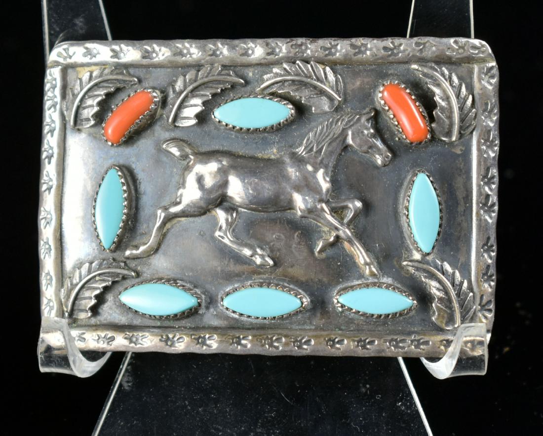 Vintage Benson Sam Sterling Silver Buckle: Vintage. Excellent buckle in Sterling silver by listed Navajo Silversmith Benson Sam. Inlaid with turquoise and coral. 39.8grams. Dimensions 76mmx51mm