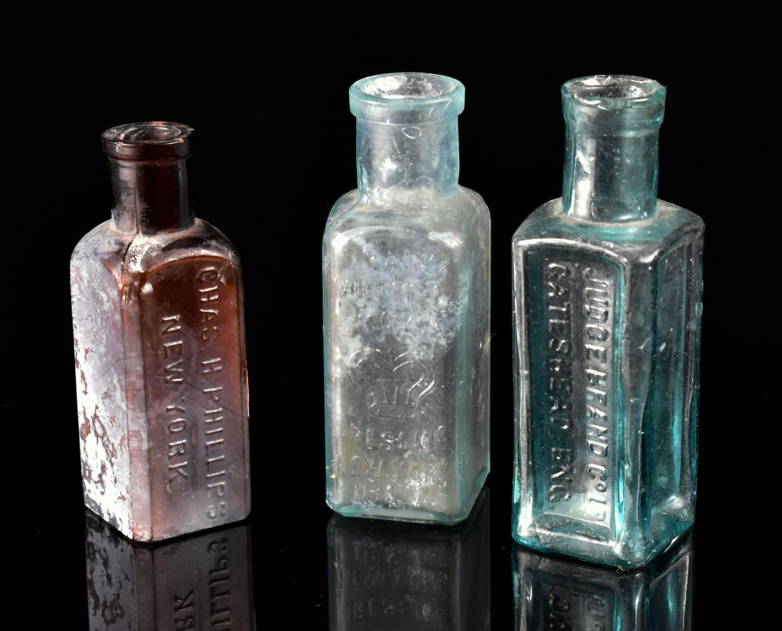 Lot of 3 1800's Bottles: Judge Brand Co. Ltf Gatehead, Eng; Frank Miller's Crown Dressing New York USA; Chas. H Phillips New York. Nice early set of bottles.
