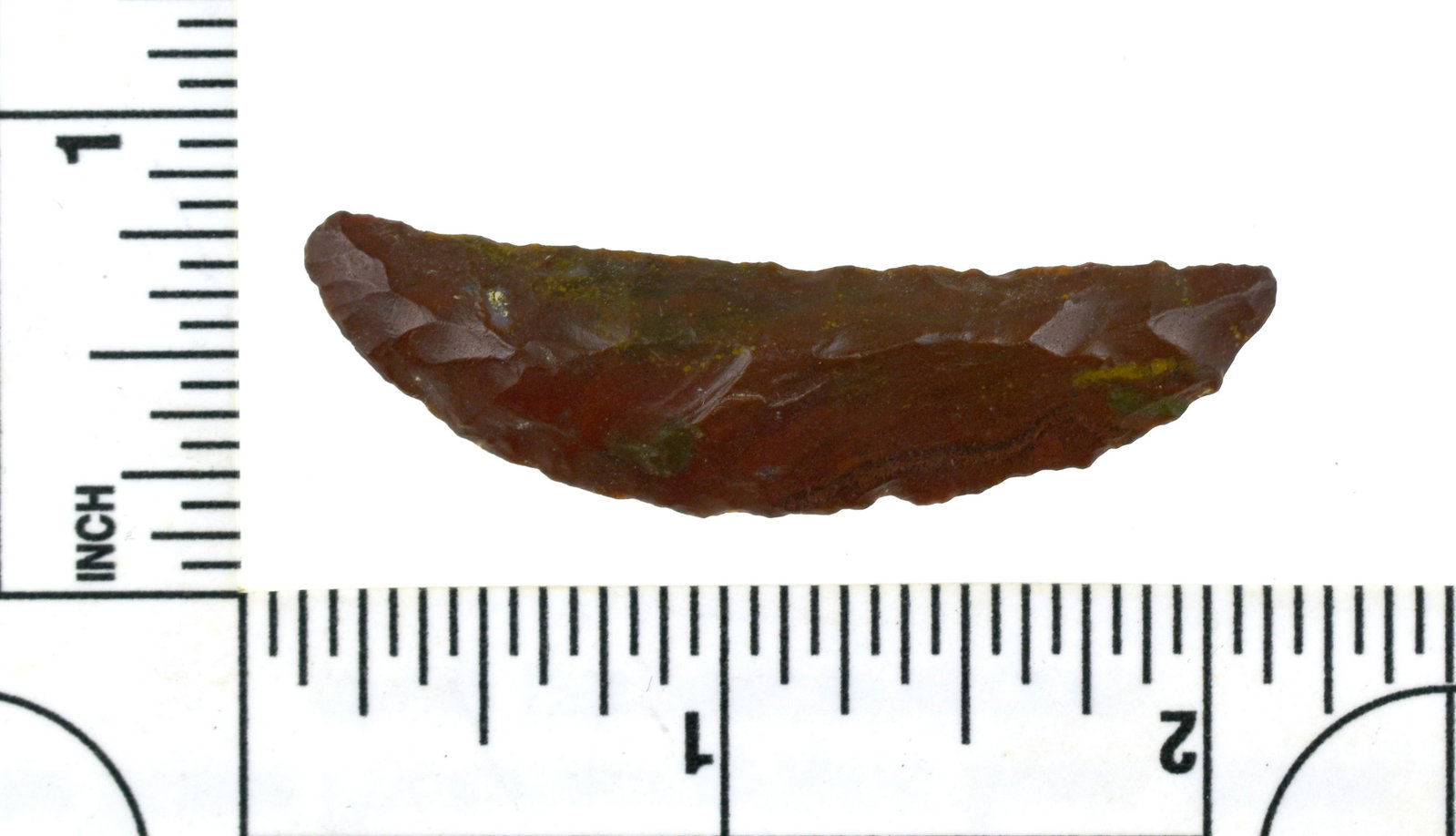 2" Paleo Crescent: Brick Red jasper example partially uniface on one side, well flaked nonetheless from the Robert Beckett Ranch Collection from Lassen Co., California.