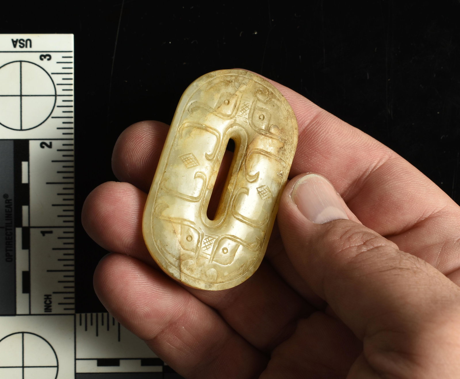Ancient Chinese Jade Belt / Sash Buckle: Early Chinese White and Russet highly refined high quality Jade buckle. Han Dynasty form. Exhibits great age with classic carved Taotie and Cloud motifs on both sides. Highly polished over its e