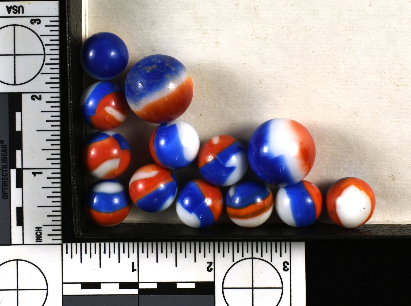 13 Vintage Marble King Marbles: Blue and Red on white