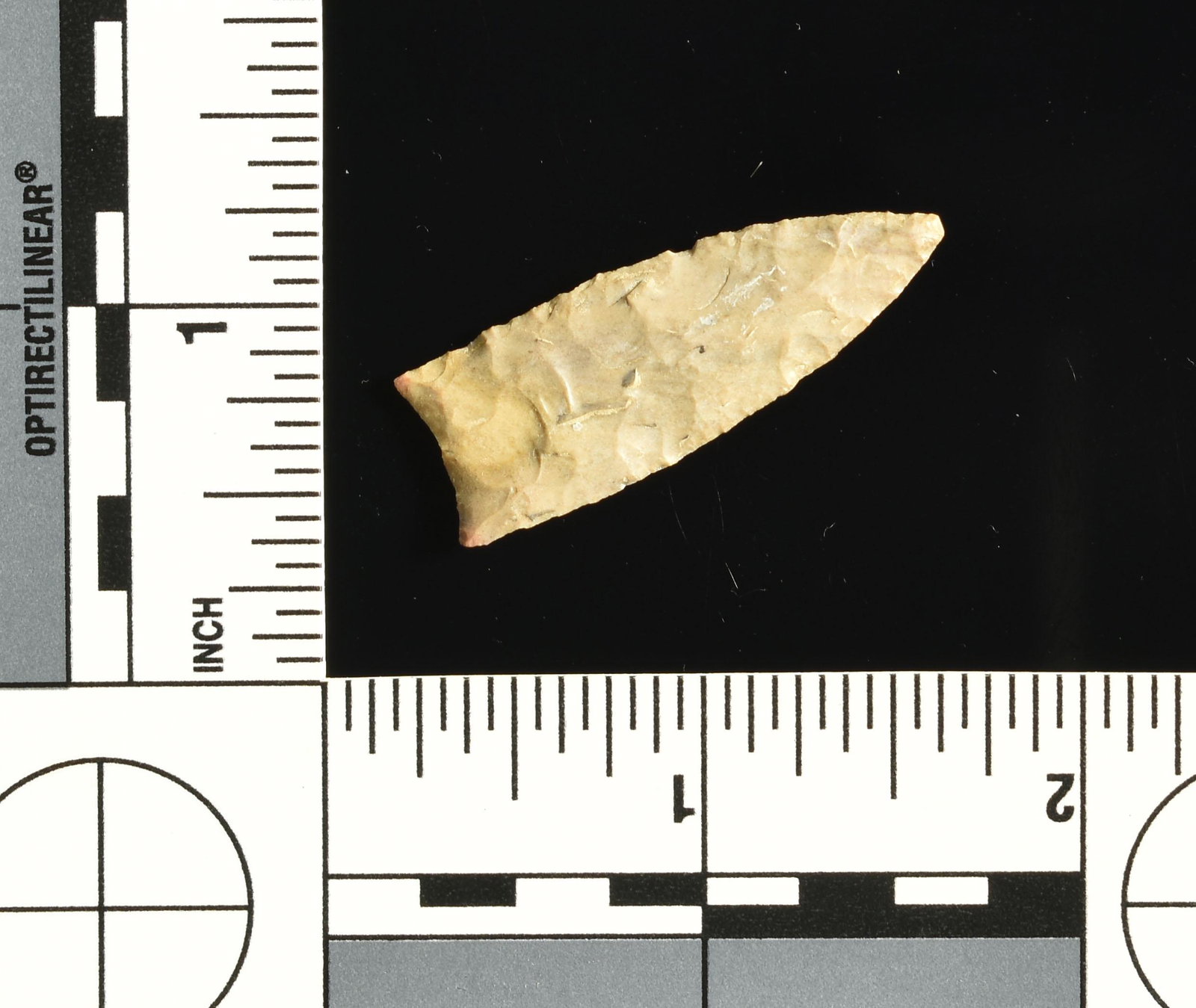 Extra Fine 1 1/2" Plainview Dart?: Actually fluted on both sides and ground on the lateral edges. Ex- Bill Jackson Collection. High grade mottled Plains chert.
