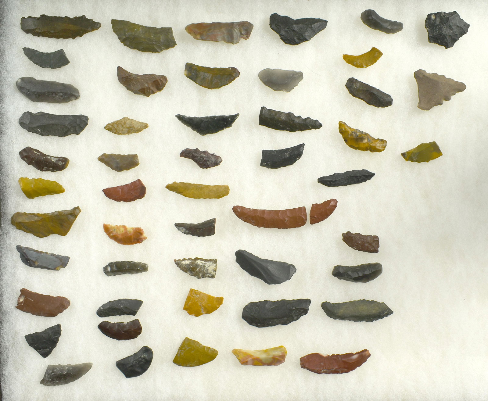 HUGE Lot of Paleo Crescents!: Large lot of lower-quality uniface, damaged, and other study pieces from Lassen Co., California. Several with serrations and a wide variety of materials represented. Ex Beckett Collection.