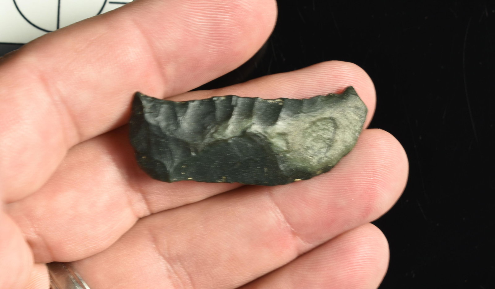 1-7/8" Paleo Crescent: Greenish Black Chert. Lassen Co., California. Ex Robert Beckett Collection.
