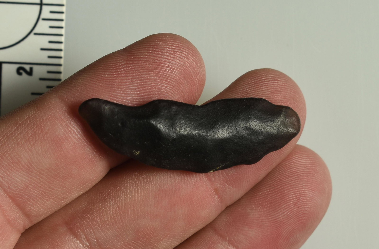 1-13/16" Paleo Crescent: Well weathered translucent obsidian. Lassen Co., California. Ex Robert Beckett Collection.