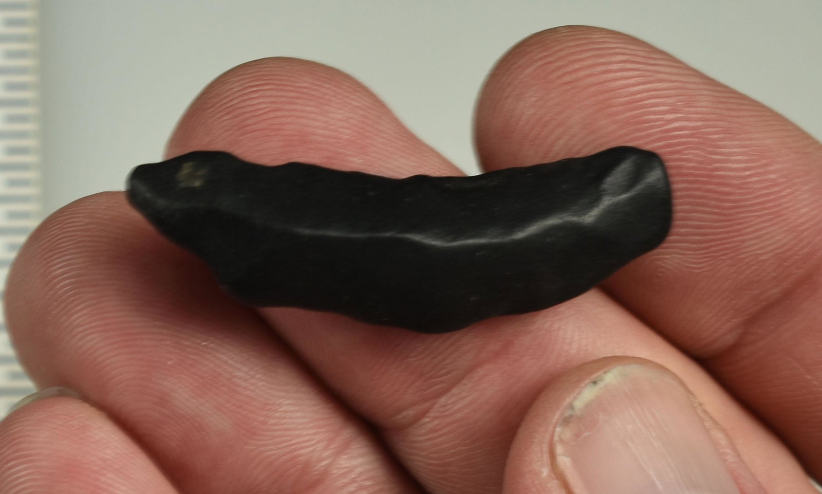 1-3/4" Paleo Crescent: Heavily wind/water worn example from the Shores of Ancient Lake Lahontan. Ex Beckett Collection. Lassen Co., California.