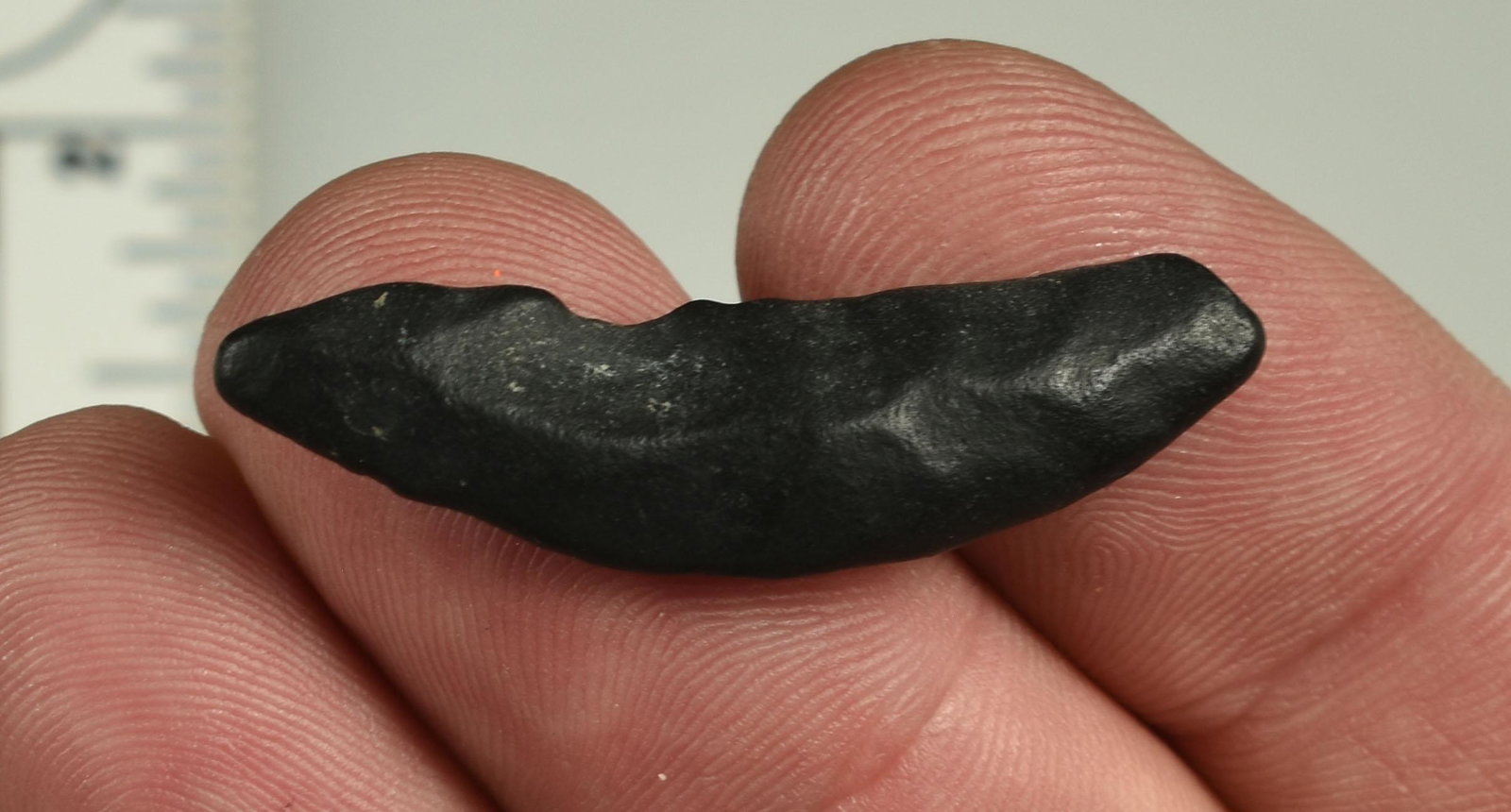 1-5/8" Paleo Crescent: Heavily weathered basalt. Ex Beckett Collection. Lassen Co., California.