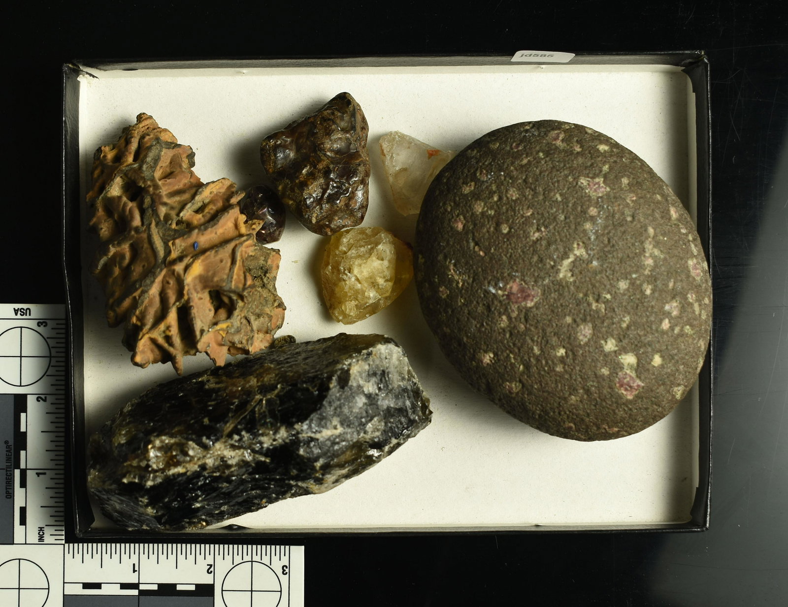 Lot of Various Mineral Specimens: Smokey Quartz Column, garnet-laden stone, amethyst, hematite, and others in this lot.