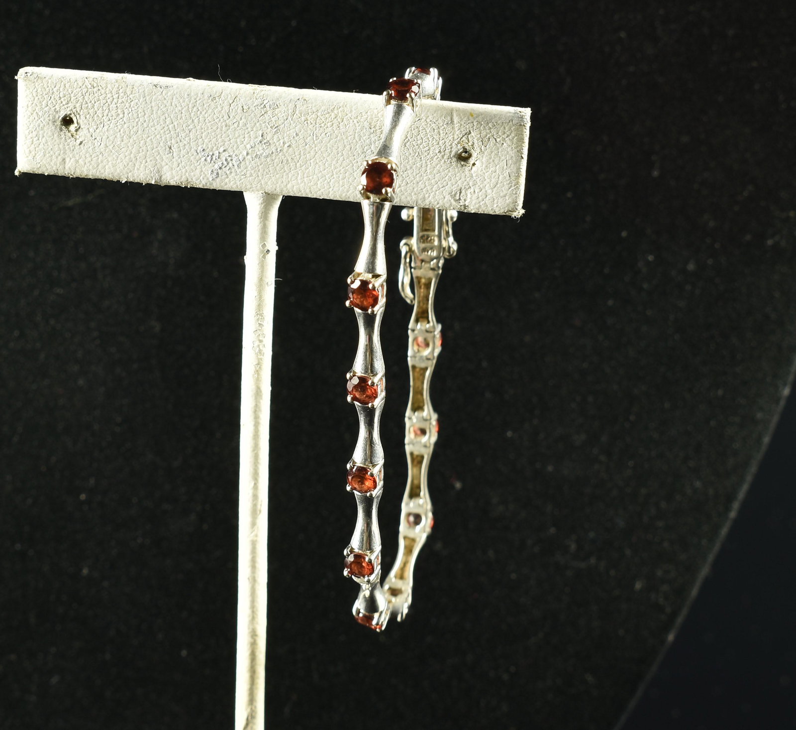 7.25" Sterling Silver and Garnet Bracelet: Super nice silver and garnet bracelet measuring 7.25" circumference. 8.6grams