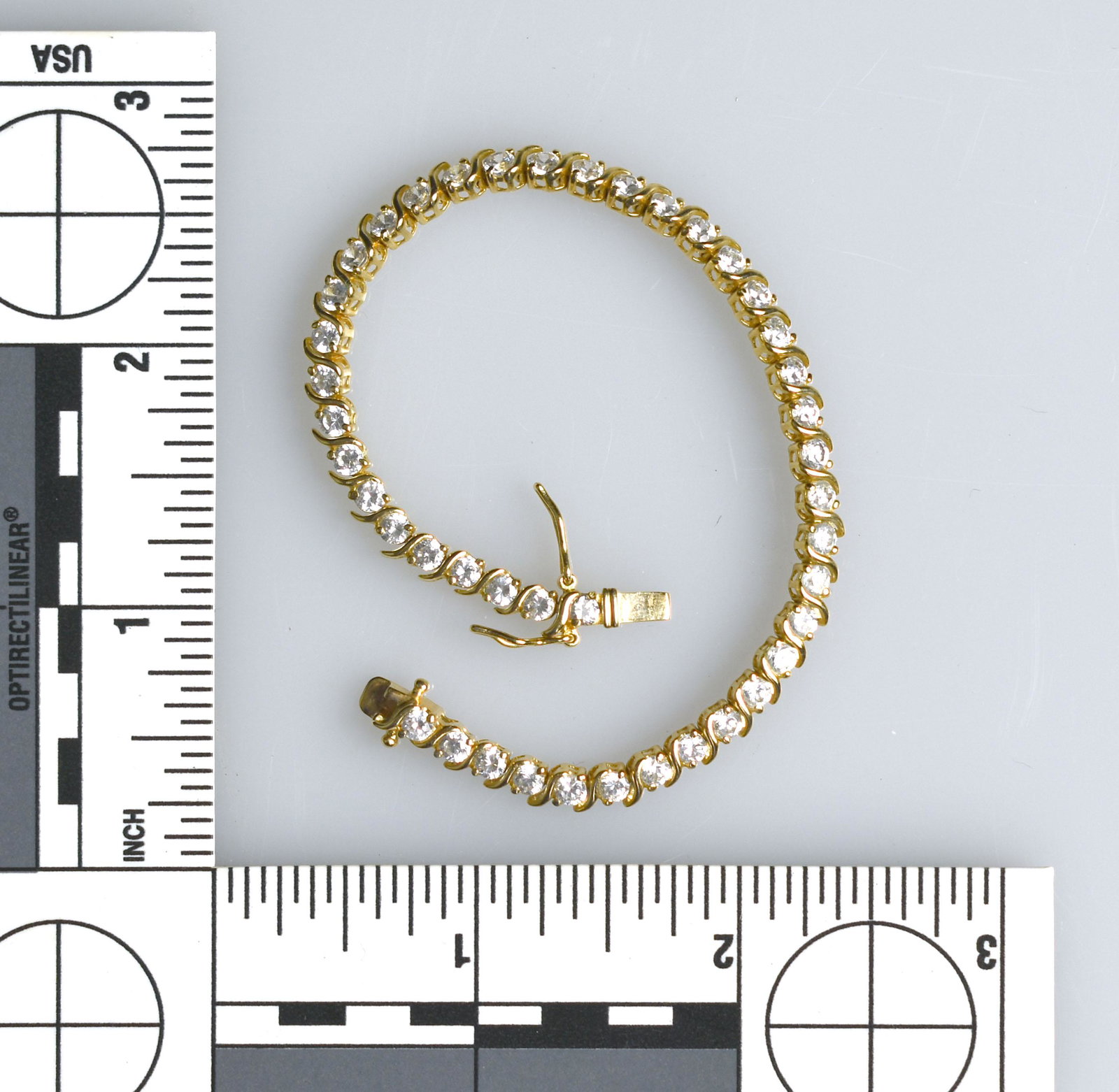 7" Tennis Bracelet: Gold Vermeel - Gold plate over Sterling Silver, with CZ stones. Nice! Excellent condition bracelet.