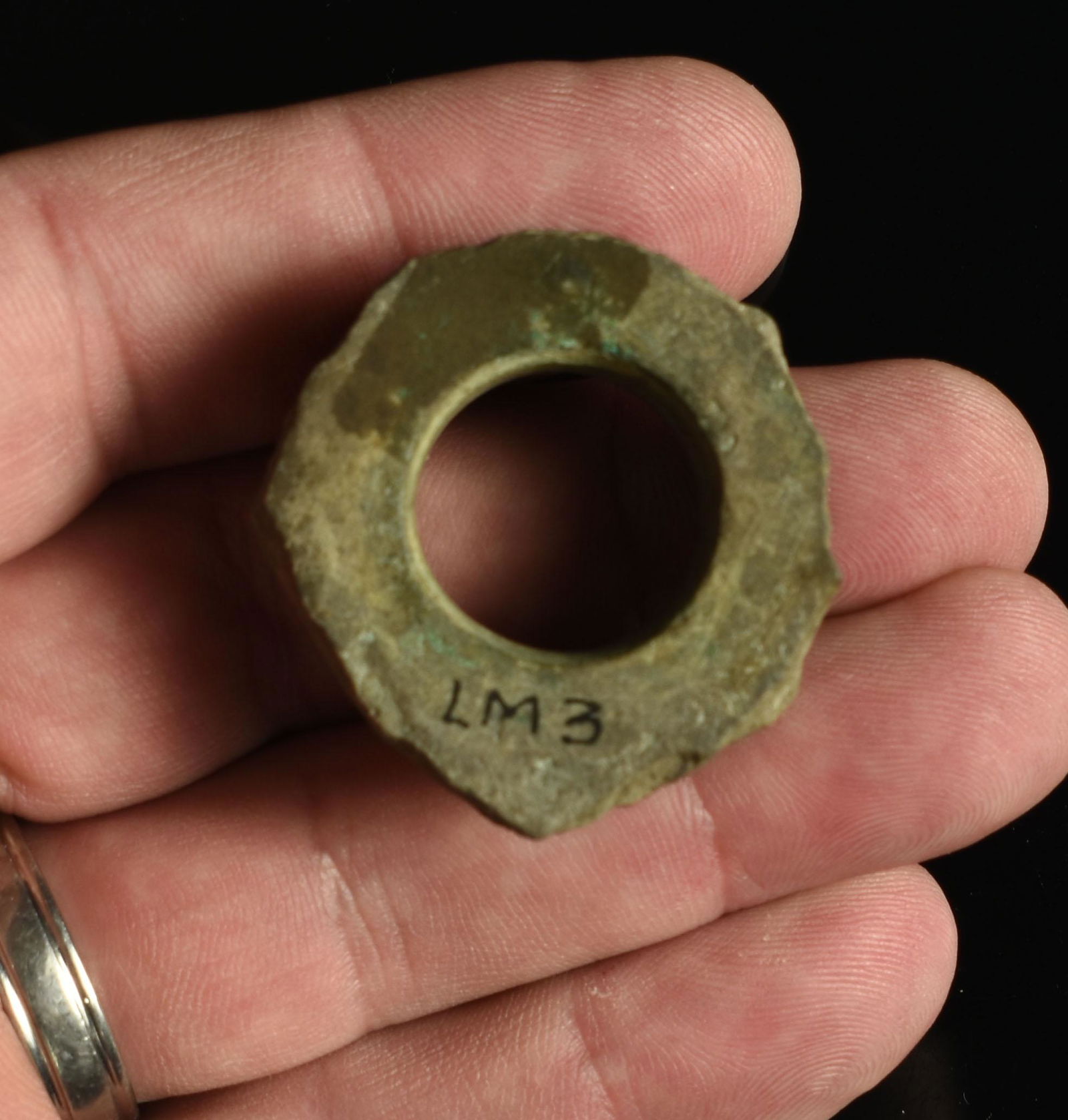 1-7/16" Spiro Ear Spool: Nice example with residual copper from LeFlore Co., Oklahoma. Reported from the Temple (Craig) Mound. Ex - Larry Johnson and Lincoln B. Smith Collections. Hardstone.