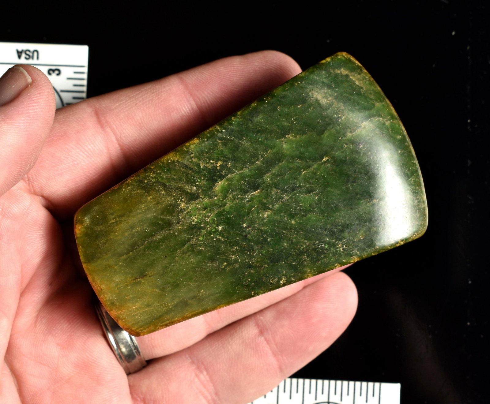 Beautiful 3 1/4" Chinese Jade Axe: Great eye appeal. Shows considerable differential weathering on the surface. Polished in modern times with traces of original earth adhesions in the crevaces. Really pretty Green Nephrite Jade with cr
