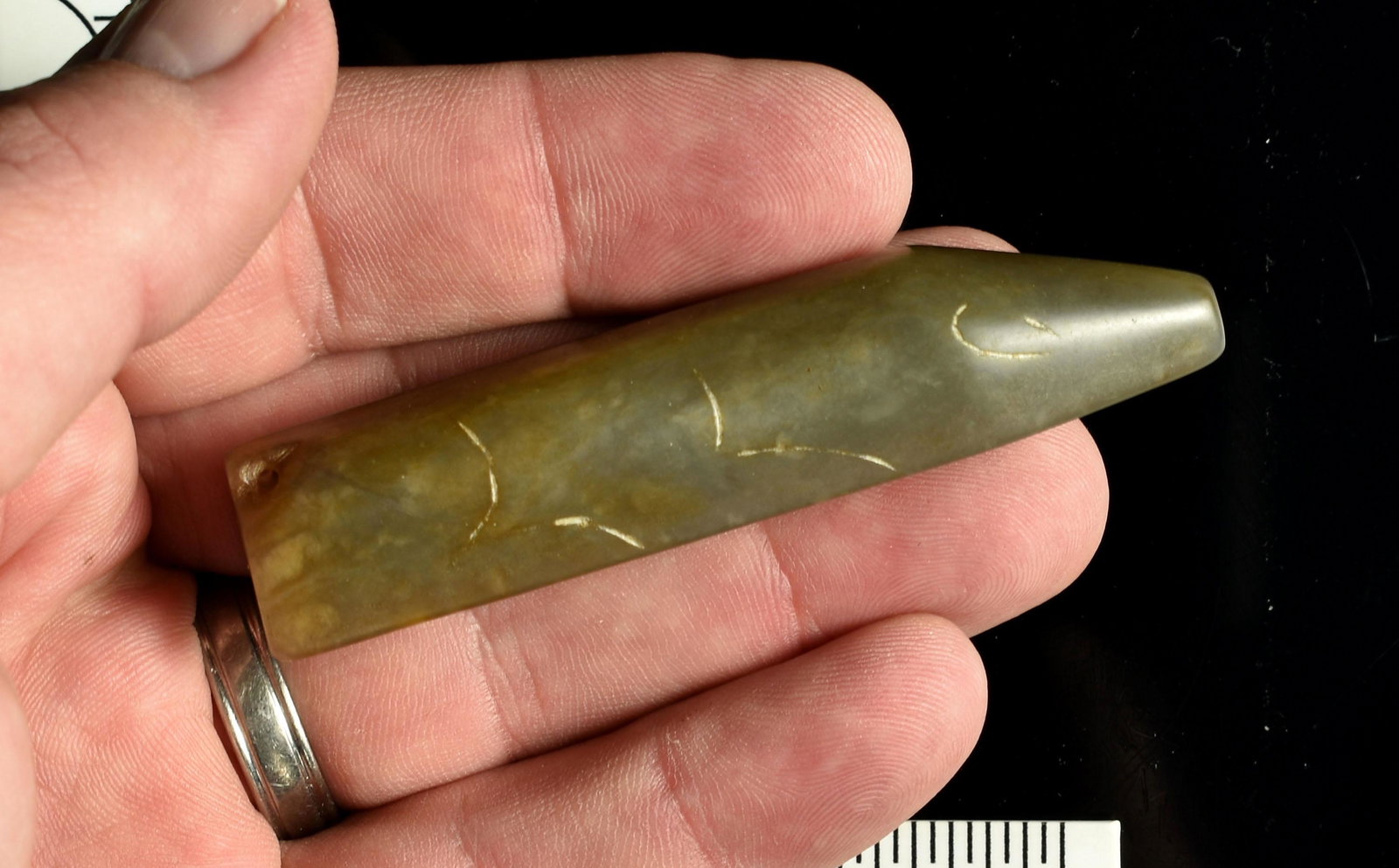 3 3/16" Chinese Han Dynasty Style Jade Pig: Made of highly translucent light green Nephrite Jade. Highly polished over its entirety with faint incising delineating legs and eyes. Drilled in the tail area for suspension so could be worn if desir
