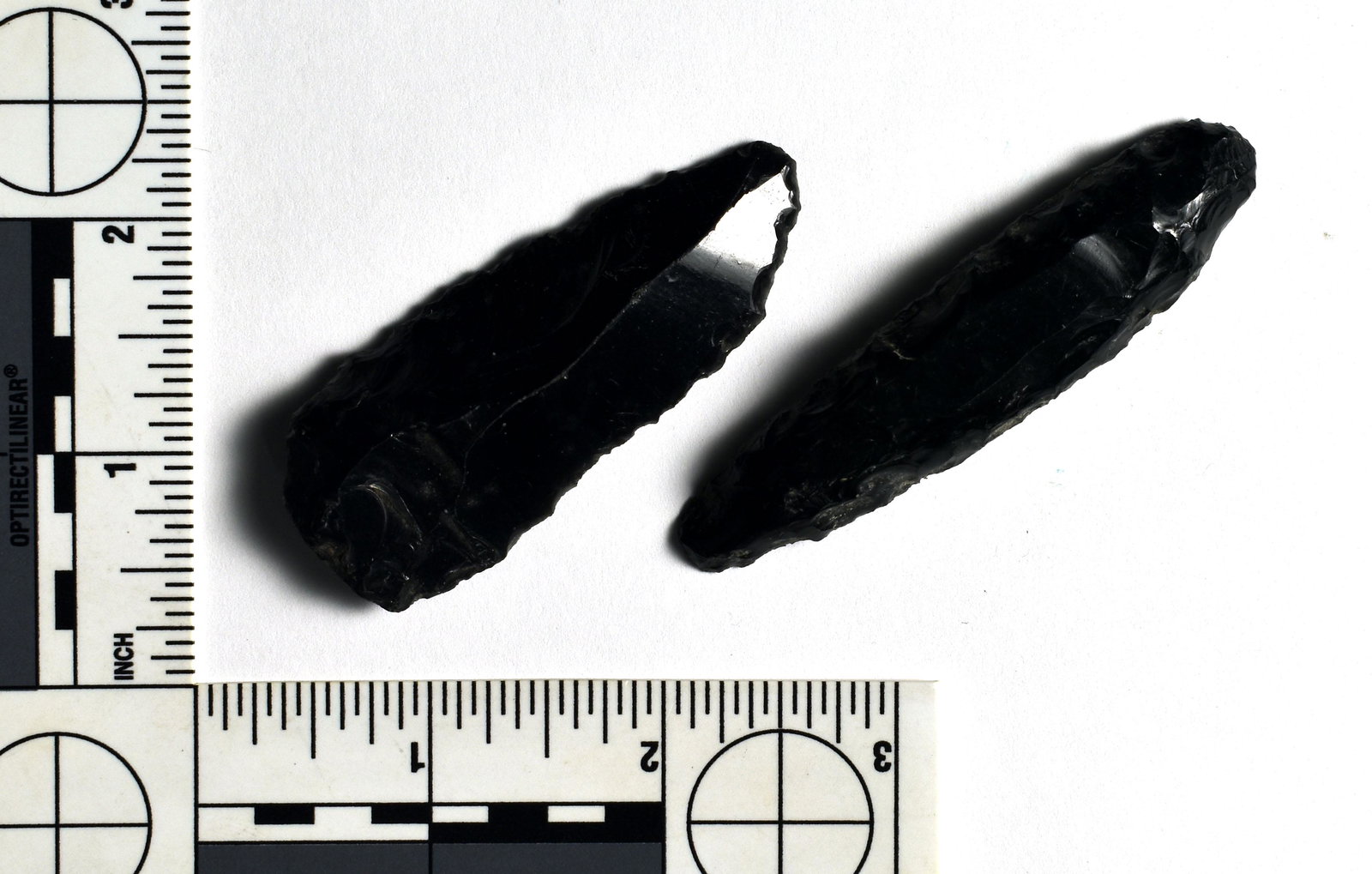 Pair of Fine Aztec Obsidian Bladelets: Both expertly crafted. Found in Teotihuacan, Mexico. Narrower example is 3 inches long and the wider one is 2 1/2" long. Uniface on one side and finely flaked on the other. Exactly like Paleo Bla