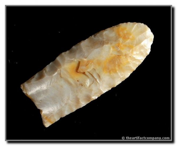 2 7/16" Clovis: Beautiful example in high-grade translucent Crescent Quarry flint. Ex- Strunk Collection. Rogers & Davis COA.