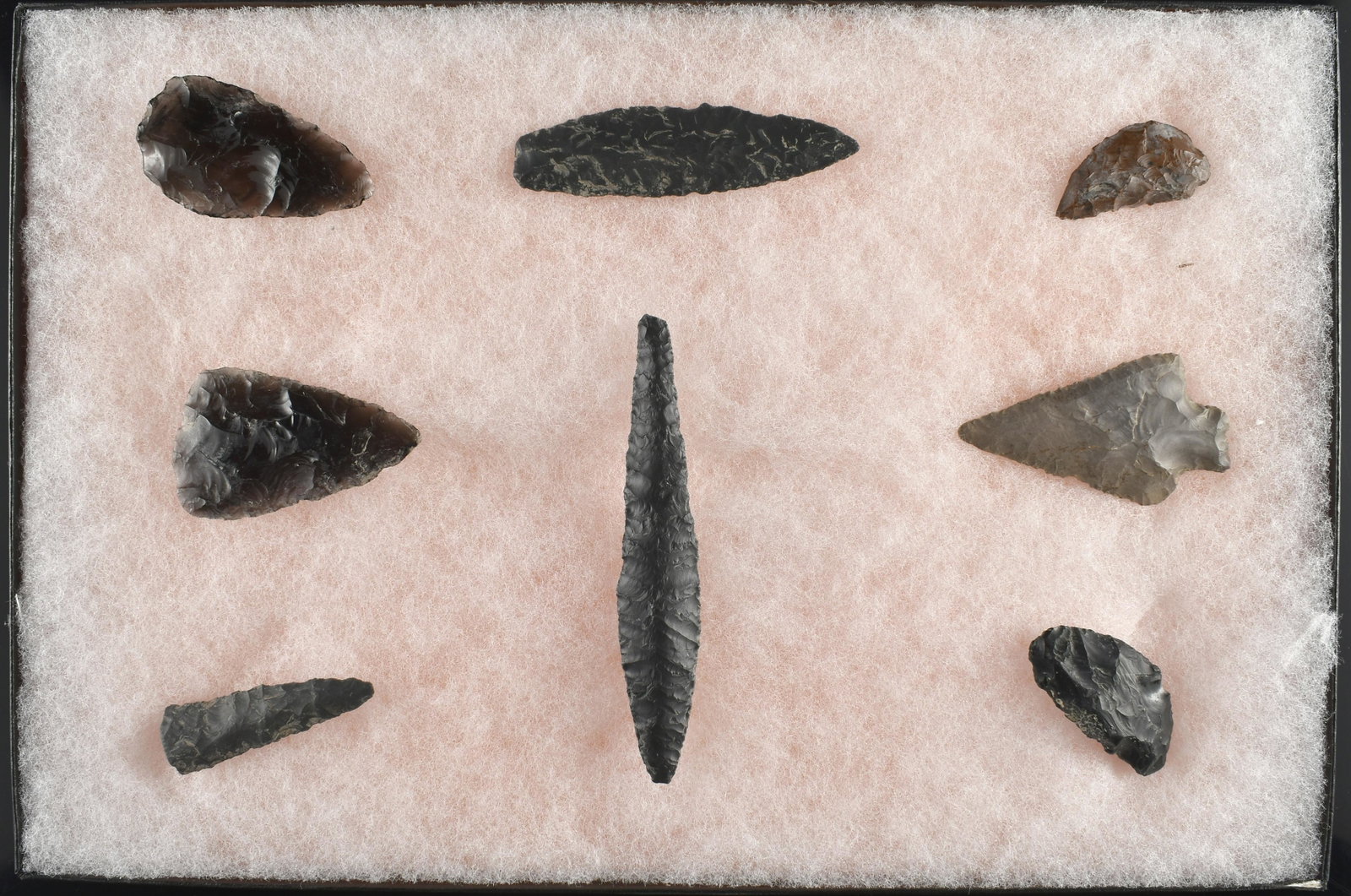 8x12 Display of 8 Oregon Artifacts: Reportedly found on the Dennis Ranch in a hay field on the Northeast shore of Crump lake in Warner Valley, Oregon. Nice assortment with the big slender point measuring 4-1/4"