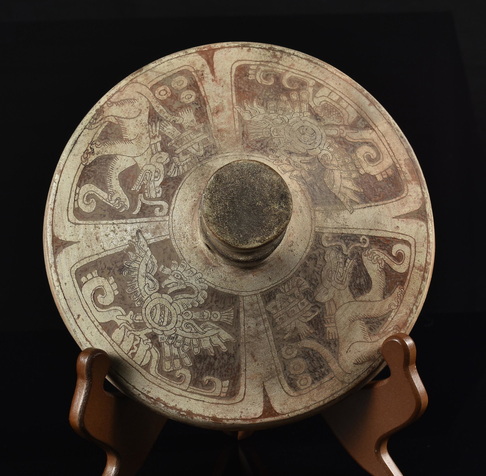 7-9/16" Pre Columbian Style Aztec Pottery Lid: A bas-relief carved Pre Columbian style Aztec pottery lid for a vessel with engraved eagles and felines with speaking scrolls. Painted red on buff showing signs of wear, but in excellent o