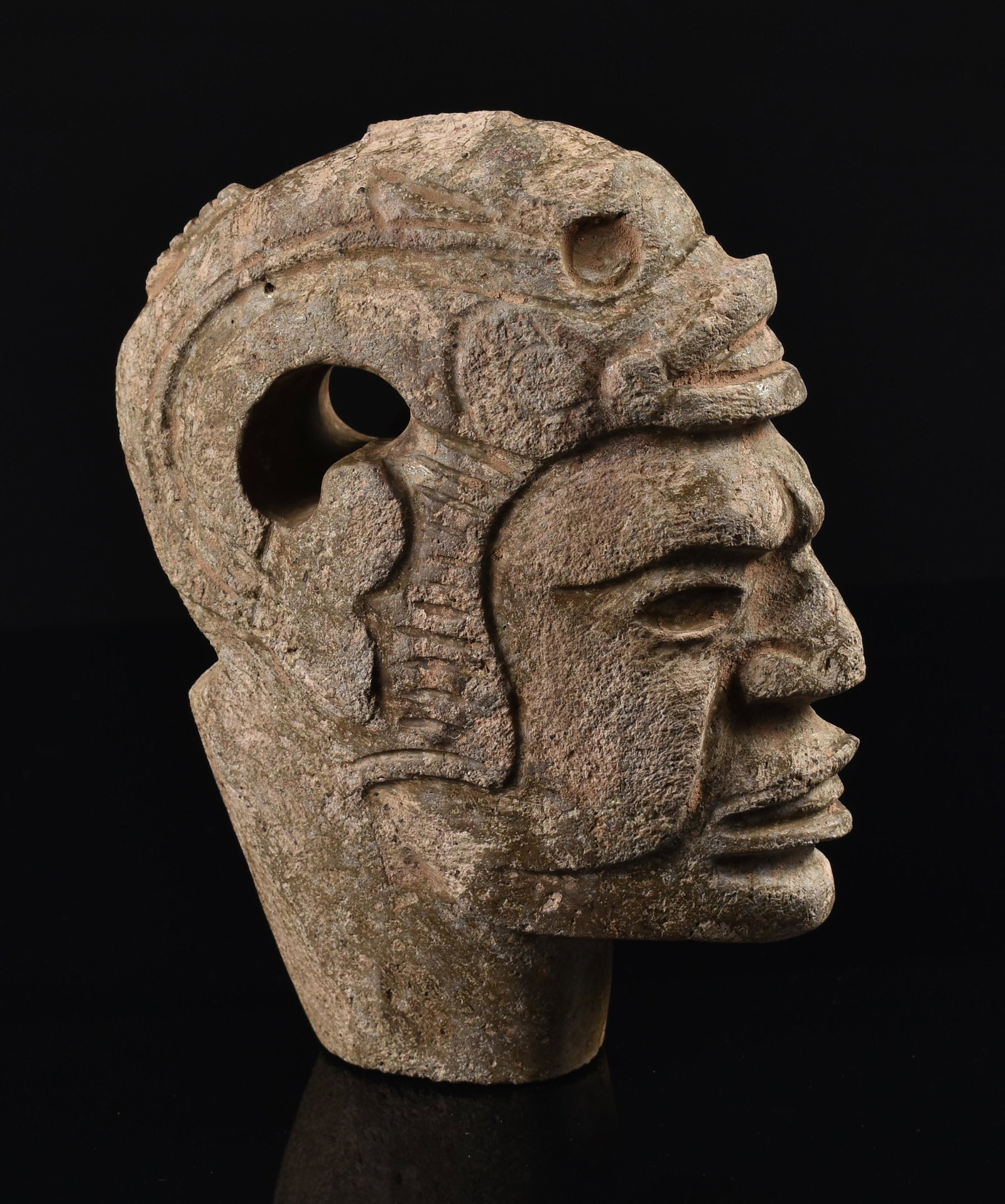 6-3/16" Pre Columbian Style Mayan Stone Hacha: A Pre Columbian style Mayan brown stone hacha depicting a portrait of a ruler with a fish headdress. Ceremonial Hachas such as this were used in association with the Pre Columbian Ceremonial Bal