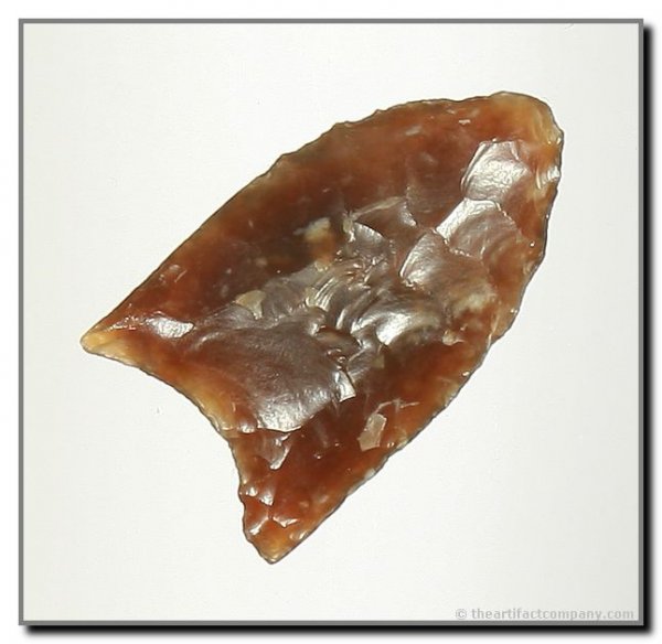074: 1 9/16" Clovis: Exceptionally translucent piece of wind-worn Knife River Flint from Wyoming. Ex - Virgil Russell Collection. Rogers COA.