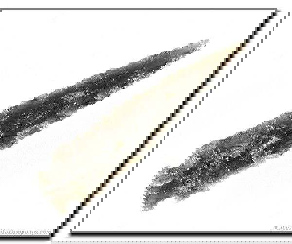 071: 2 5/16" Rose Springs Side Notched: Highly translucent, slender point from Klamath Co., Oregon. Obsidian. Ex - Bodle Collection.