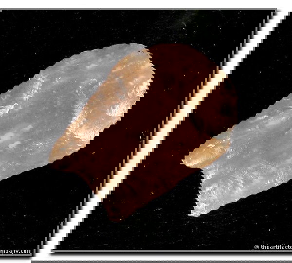 1 1/8" Folsom: Fluted to the tip on both sides, this totally translucent example in Flattop Chalcedony was found by George Green at the Tin Camp Ranch in Lincoln Co., Nebraska