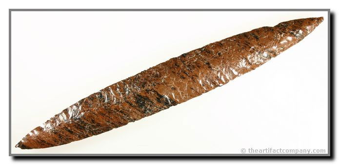 092: 11 1/2" Colima Threshold Cache Blade: Gorgeous mostly red with some black Mahogany Obsidian. Huge and slender with awesome transverse flaking. From the Lake Chapala Region on the border of the states of Jalisco and Michoacán. Tabasco Cul
