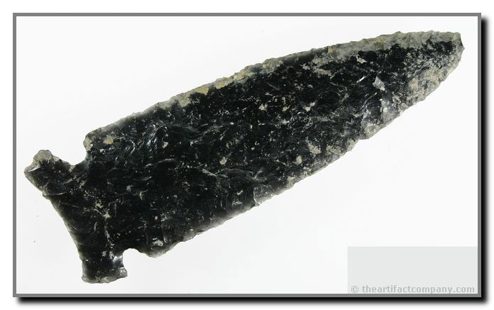 5 3/8" Northern Side Notch: HUGE EXAMPLE!!!! And, phenomenally well made. Overall flaking is amazing. Jet black glossy Obsidian loaded with alkaline salts. Really a terrific 'Centerpiece' grade relic. Found by Justin Matthews in