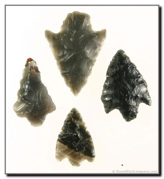 Mini-Collection Of 4 Oregon Stemmed Obsidian Point: 4 very nice, thin stemmed Obsidian points from Oregon. 3 are translucent, 1 having beautiful striping. Largest is 1 3/4" long. Ex- Bodle.