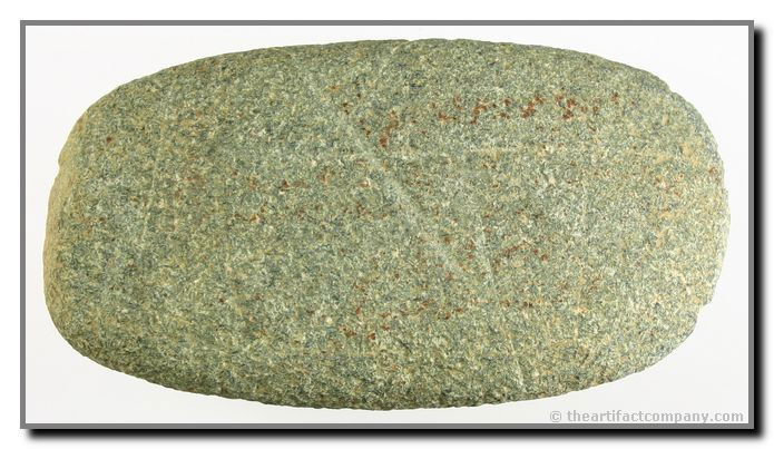 Nice Granite Kentucky Celt: This nice Celt is 4 1/2" long and is made from green speckled granite. It was found in Mason Co., Kentucky by Roger Schweickart.