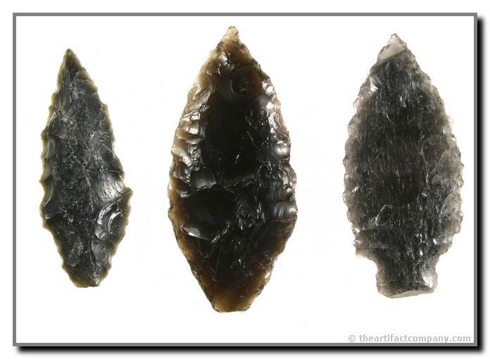 3 Very Nice Early Archaic Obsidian Blades: 3 well mineralized Early Archaic stem form blades. These Obsidian pieces range in size from 2 1/8" -2 1/2" and are from Klamath Co., Oregon. Ex- Bodle.