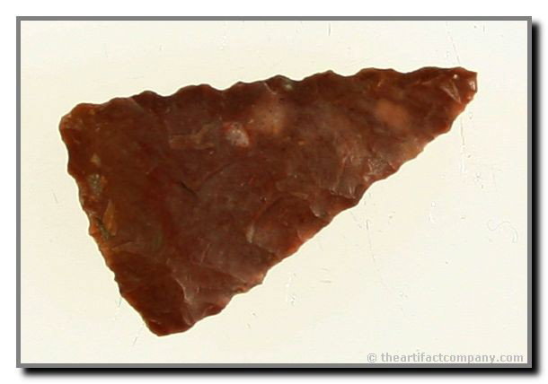 15/16" Fresno: Made of a pretty red Jasper and serrated on all three sides. Obviously made for ceremony. Found by Guy G. Moore in Saline Co., Arkansas.