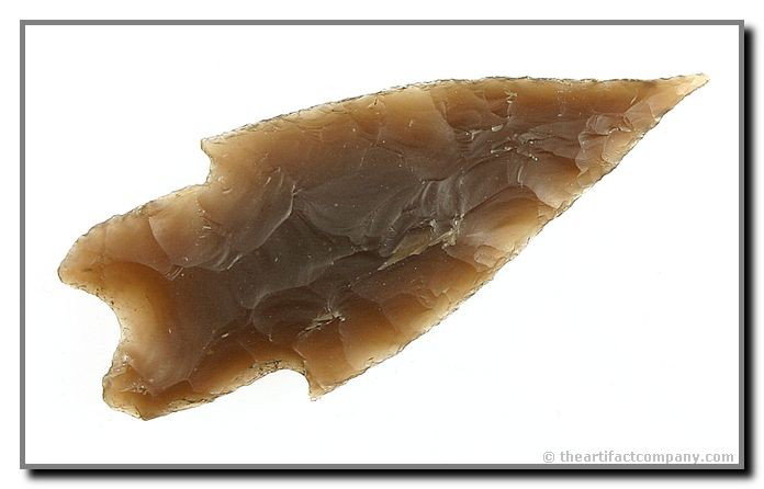 3 1/4" Pedernales: Totally translucent Root Beer example found along the Frio River near Leakey, Real Co., Texas. Needle tipped and KILLER! Ex - McIntosh Collection.