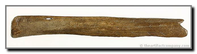 9 1/4" Eskimo Engraved Armor Plate: This early example includes excellent surface engraving and an elongated mounting hole. Alaska. Bone.