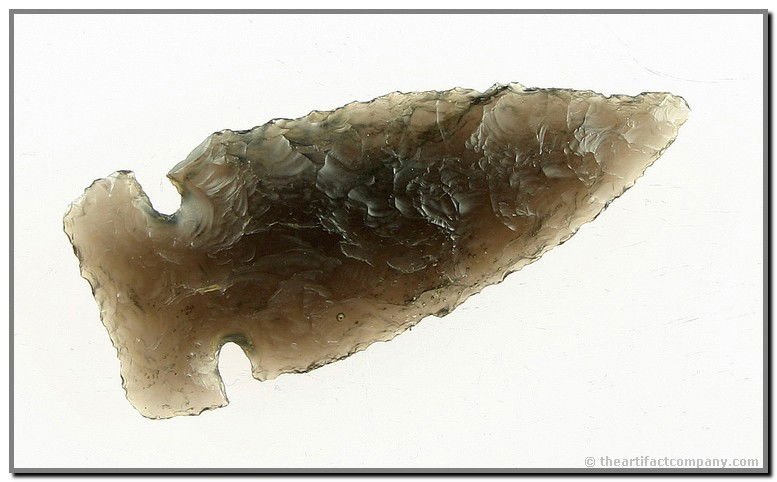 037: 2 1/4" Northern Side Notched: Extremely translucent Ice Obsidian example that is thin and very well made. Found in Oregon. Ex- Dr. Joe Daugherty Collection.
