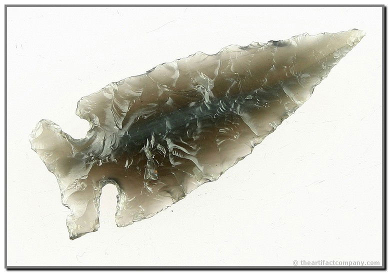 050: 2 3/8" Northern Side Notch: Beautiful translucent Ice Obsidian with smokey streaks running the entire length of the item. Needle tip. Great condition. Deeeeeep notches!! Found in Lake Co., Oregon. Ex- Kirkpatrick Collection.