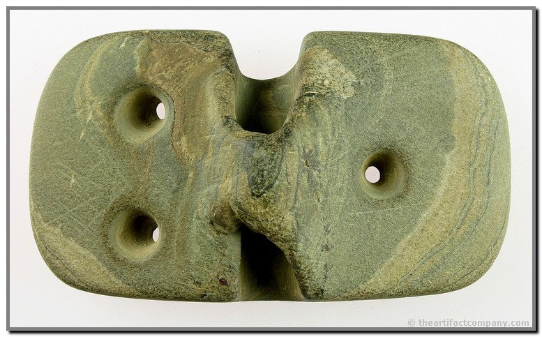 2 1/2"x 4 1/2" Bannerstone: Unusual drilled example which was done to reinforce the haft. Clearly a heavily used example. Found by Anthony Angelo in 1950 near Springdale in Hamilton Co., Ohio. Slate.