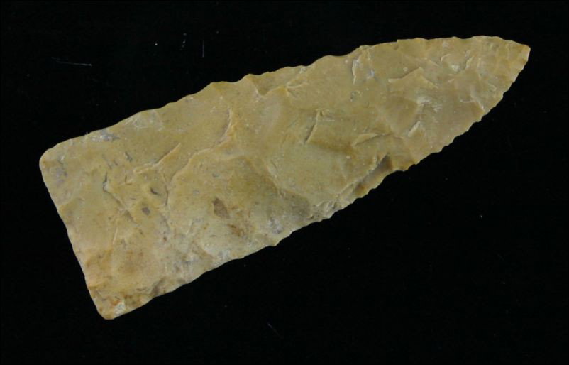 2 1/2" Scottsbluff: Nice form and flaking. Heavily ground lateral stem edges and base. Made of tan Edwards Plateau Chert. Found in Central Texas.