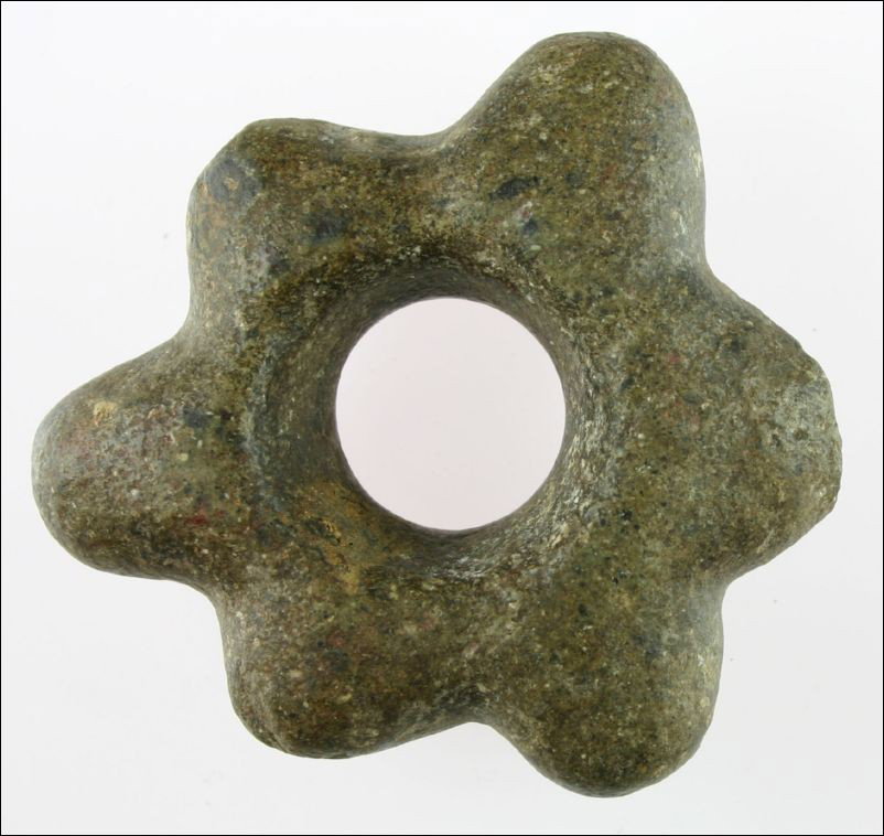 4" Chavin Culture Mace head: Extra nice example. Highly developed form with 6 nodes made from brown hardstone. Slight damage on back side of one node. Dates in the 1200-200 B.C. range. From Peru. Grandfathered Collection.