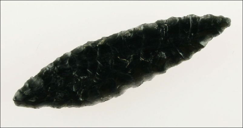 2 3/4" Cascade: Great flaking. Nice form and symmetry. Glossy Jet Black Obsidian. Found in Lake Co., Oregon. Ex- Kirkpatrick Collection.