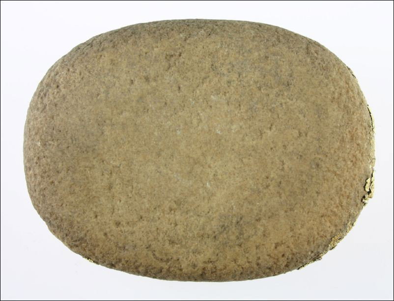 Perfect 5 1/4" Quartzite Mano from Arizona: Great quartzite example. Perfectly formed. Measures 5 1/4 X 3 7/8 X a board flat 1 1/2 inches. Polished over its entirety and exhibits different color side to side due to desert exposure. Also has are