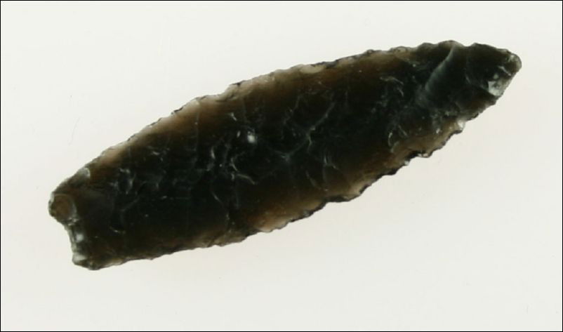 2" World Class Humboldt: This one has it all. Flaking, glossy Jet Black Obsidian, and perfect symmetry. Found in Lake Co., Oregon. Ex- Kirkpatrick Collection.