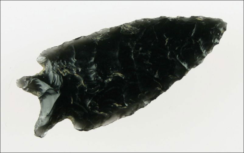 Exceptional 2" Pinto Basin: Exqusite flaking. Nice long ears and made of translucent high grade Obsidian. They don't get much better. Warner Valley, Oregon. Ex- Bill Jackson Collection.